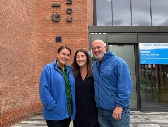 Three people standing outside Girdwood Community Hub